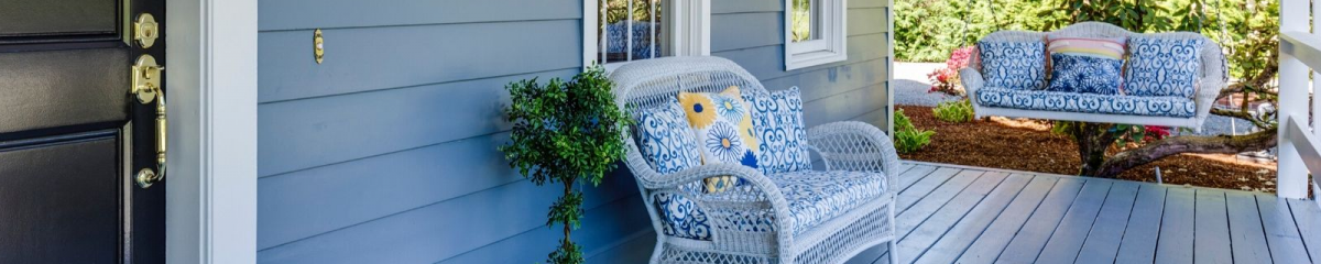 front porch of home with porch swing